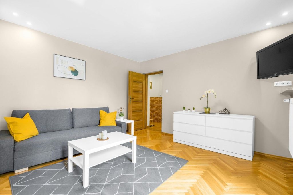 white coffee table with a grey couch